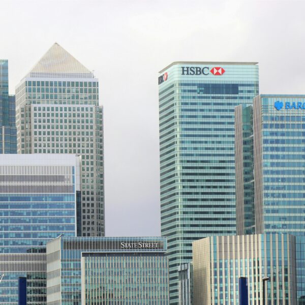 Modern skyline of Canary Wharf featuring iconic bank skyscrapers like HSBC and Barclays.