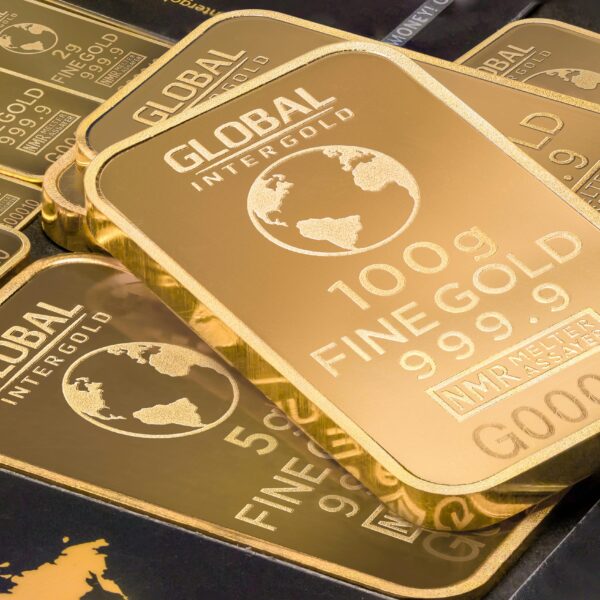 A detailed shot of gold bars labeled 'Global Intergold' as a symbol of wealth and investment.