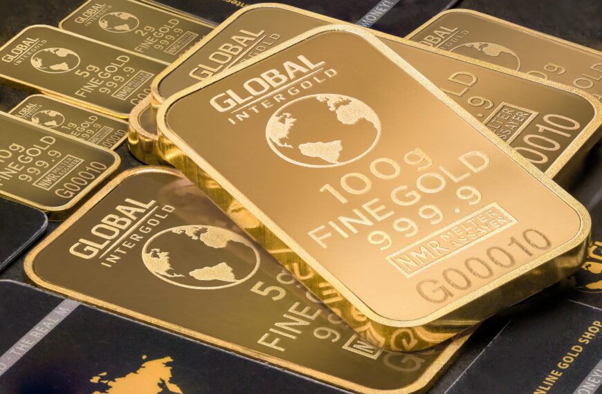 A detailed shot of gold bars labeled 'Global Intergold' as a symbol of wealth and investment.
