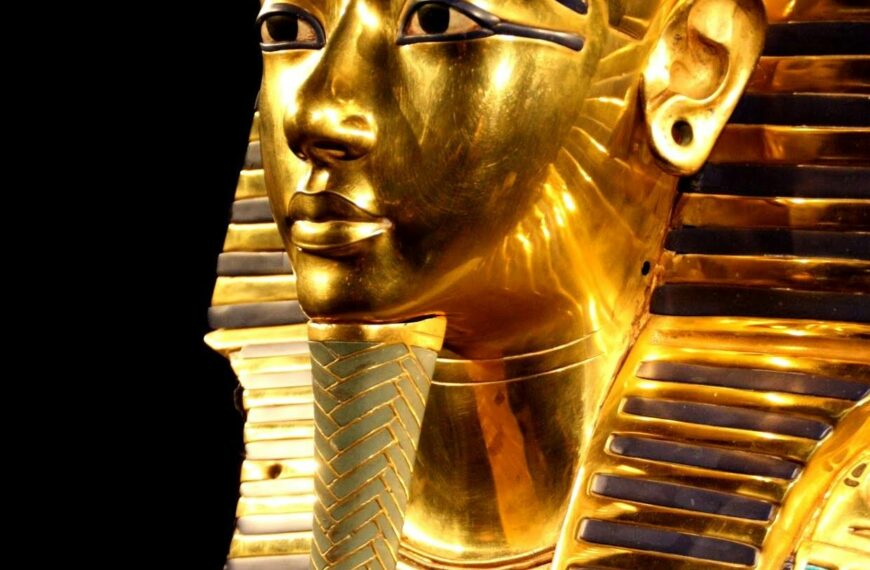 Close-up of Tutankhamun's gilded death mask showcasing intricate design.